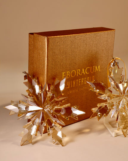Gold book with 'Eboracum Wintergarden Crystal' on a beige background