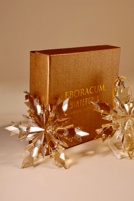 Gold book with 'Eboracum Wintergarden Crystal' on a beige background